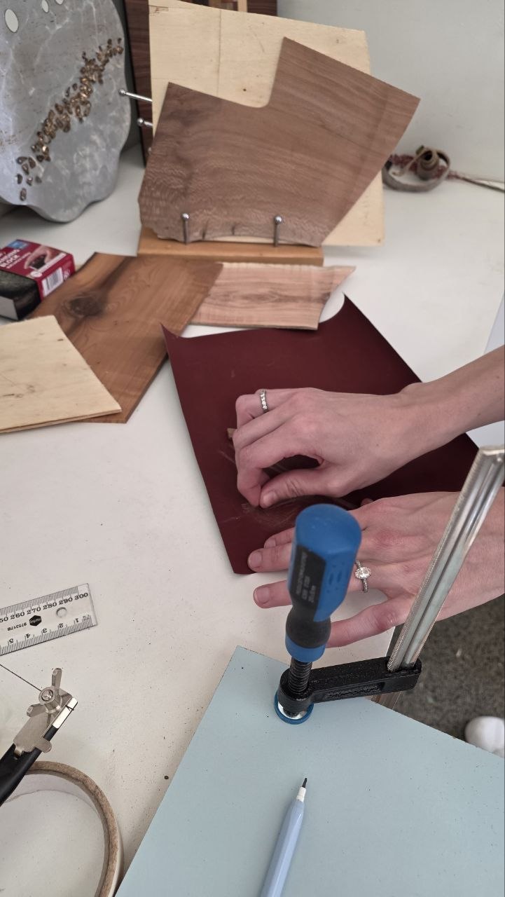 Artist working at the marquetry workbench